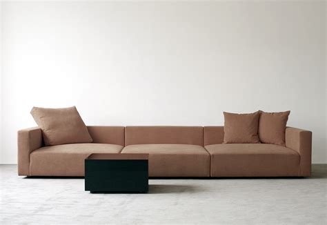 The armrests are slimmed so they don't occupy much space and even the legs of the sofa are angled making it look classier. Deep sofa by fluidum | STYLEPARK