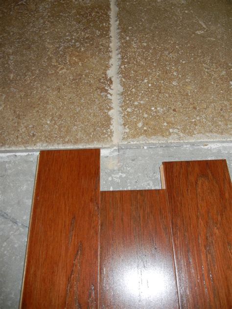 I just looked at mine and i believe you do need a transition piece. Transition - travertine to engineered wood flooring