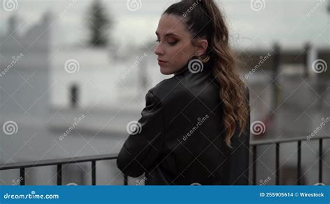 Black Dressed Caucasian Female With A Suitcase Standing In A Hotel