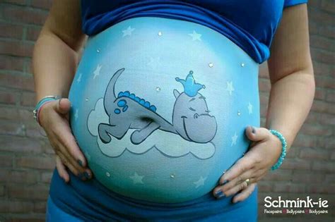 A Pregnant Woman Is Holding Her Belly In The Shape Of A Dog With Stars
