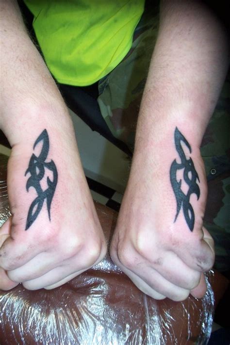 Tattoo Design Art Matching Tribal Tattoos On Each Arms