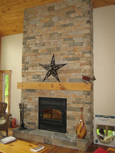 fireplace veneered with cultured stone aspen country ledgestone and natural hearth stones