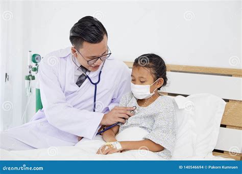 The Doctor Is Treating The Girl Stock Photo Image Of Patient Girl