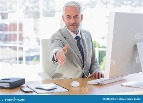 Smiling Businessman Reaching Out Hand For Handshake Stock Photo Image