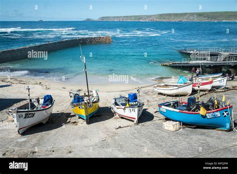 Small Fishing Boats On A Slipway In Sennen Cove In Cornwall Stock Photo