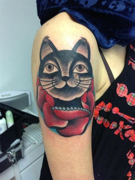 Check spelling or type a new query. A happy cat with a rose makes up this tattoo design in an ...