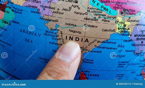 Finger Pointing To The Country Of India On A Globe Stock Image Image