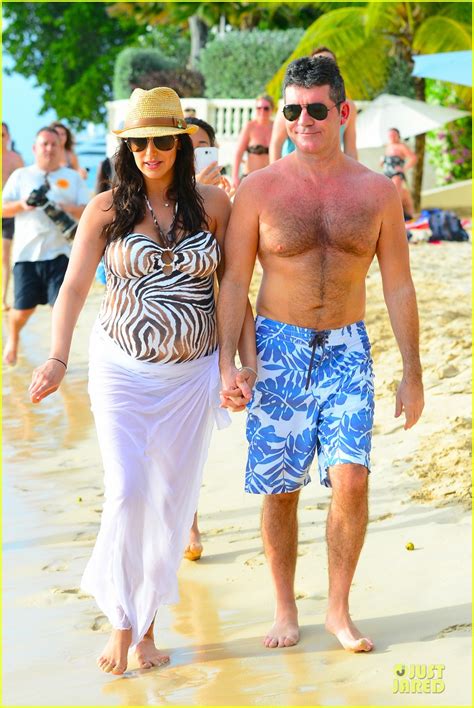 simon cowell and lauren silverman hold hands on new year s eve photo