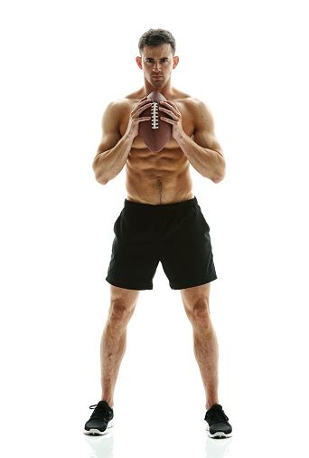 Muscular Man Posing With Football Stock Photo Download