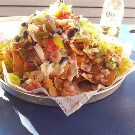 it s a pensacola beach tradition make sure you try the seafood nachos at flounder s chowder