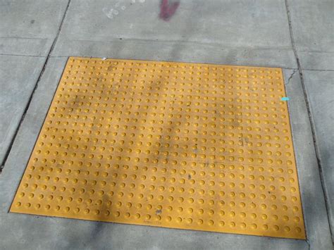 What Are The Yellow Bumps On Sidewalks Called As You Are Crossing