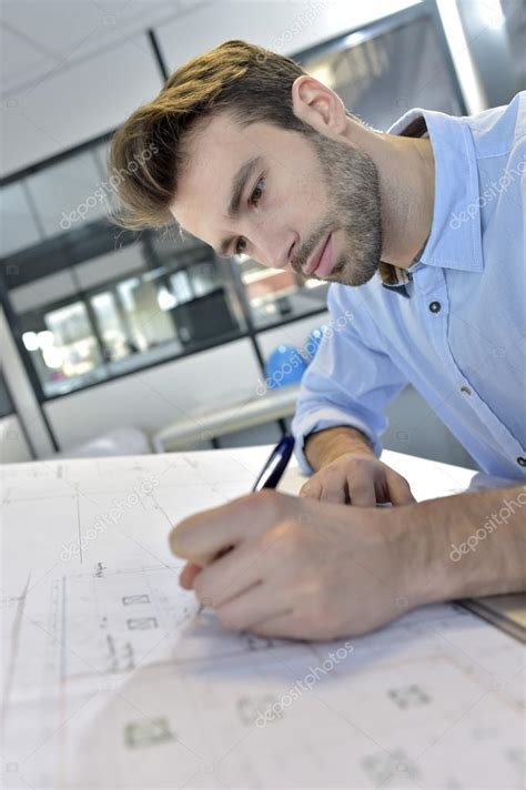 Architect Designing On Drafting Table Stock Photo By ©goodluz 67893929