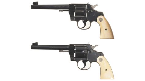 Two Colt Officers Model Target Double Action Revolvers