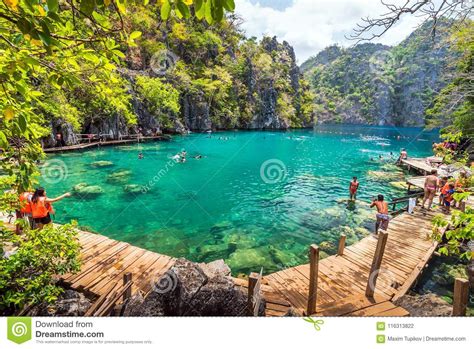 People Tourists Swimming At Kayangan Lake In Coron Island