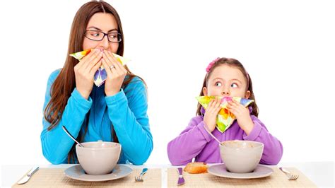 Mother Teaching Daughter Table Manners