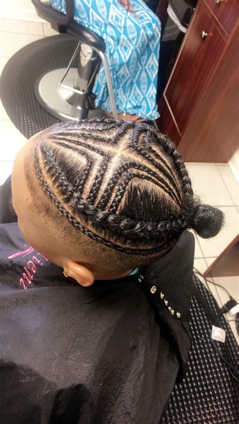 An undercut is a trendy alternative to a fade, and is a great summer hairstyle for boys. Pin by Shaye payne on Men Braids bun | Braids for boys ...