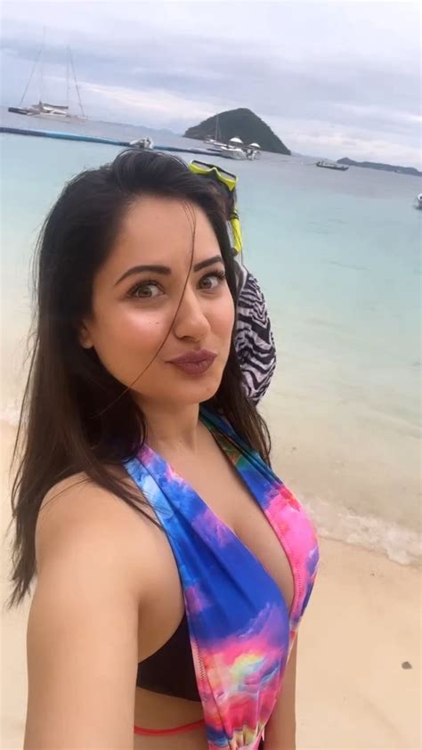 puja banerjee flaunts ample cleavage in multi color swimsuit while giving a tour of the beach