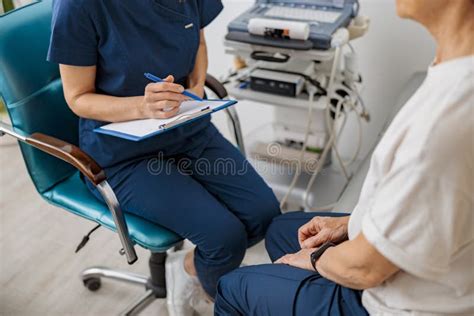 Close Up Of Doctor Ultrasound Specialist Makes Notes During Patient