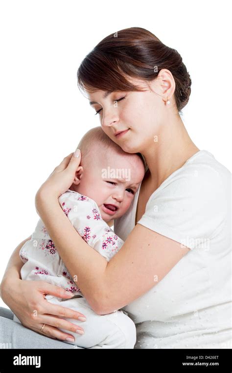 Mother Trying To Comfort Her Crying Baby Isolated Stock Photo Alamy