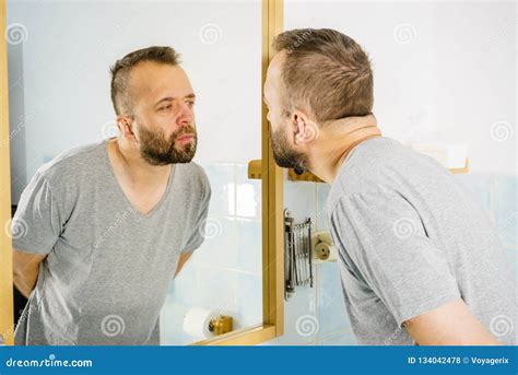 Man Looking At Himself In Mirror Stock Photo Image Of Care Adult
