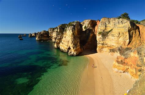 *lacobriga) is a city and municipality at the mouth of bensafrim river and along the atlantic ocean, in the barlavento region of the algarve, in southern portugal. Pristine Beaches and Dramatic Shoreline in Lagos, Portugal | Places To See In Your Lifetime