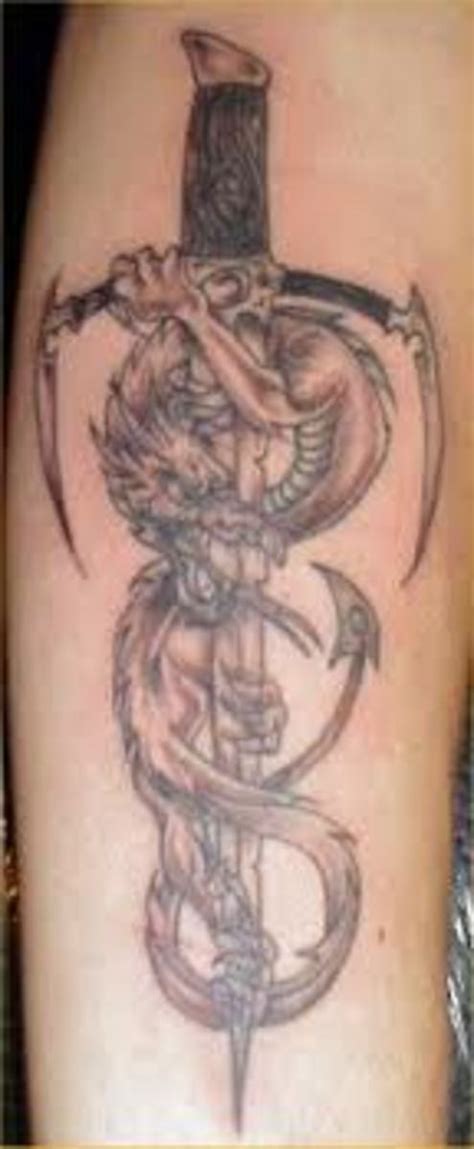 It's a battle scene between a knight in armor with a sword and a shield bravely slaying a winged dragon. Sword Tattoos And Meanings