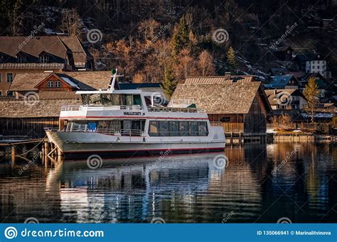 Scenic View Of Hallstatt Lake With A Boat In Austrian Alps Editorial