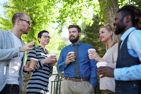 Group Of Colleagues Talking At Outdoor Meeting Stock Photo Dissolve