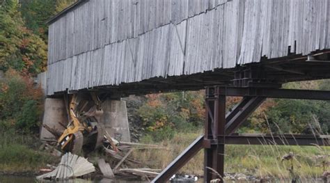 Excavator Crashes Through Historic Covered Bridge Remains Stuck Cbc News