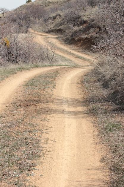 Premium Photo Dirt Road In The Hills