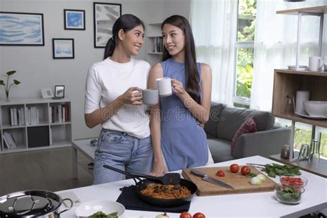 Romantic Asian Lesbian Couple Is Cooking On Kitchen Lgbt Lesbian Couple Are Having Fun Together