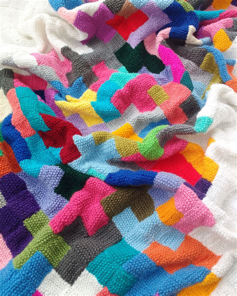 Knitting A Patchwork Blanket Of Mini Squares With Leftover Yarn