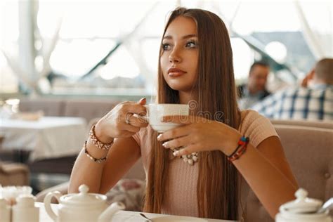 Beautiful Girl Drinking Tea In A Summer Cafe Stock Photo Image Of