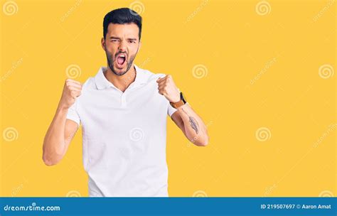 Young Handsome Hispanic Man Wearing Casual Clothes Angry And Mad