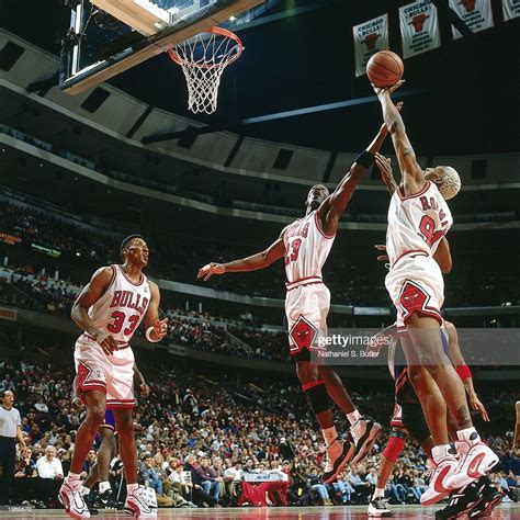 Michael Jordan Of The Chicago Bulls And Teammate Dennis Rodman Grab A