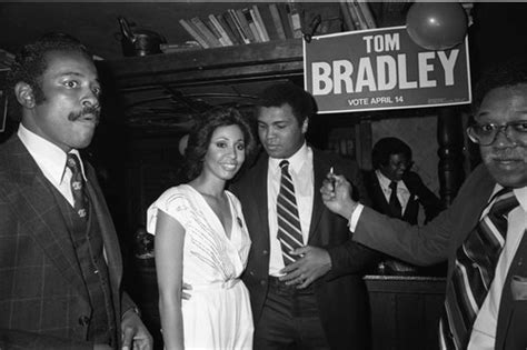 Muhammad Ali Standing With Others At A Rally For Tom Bradley Los