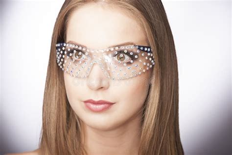 Close Up Portrait Of Beautiful Young Woman In Glasses On Dark Blue