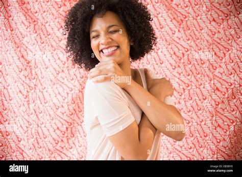 Smiling Woman Hugging Herself Stock Photo Alamy