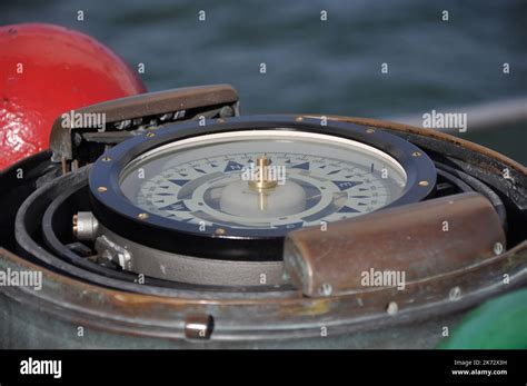 Compass Of An Old Sailing Ship Shows The Way In Detail View Stock Photo