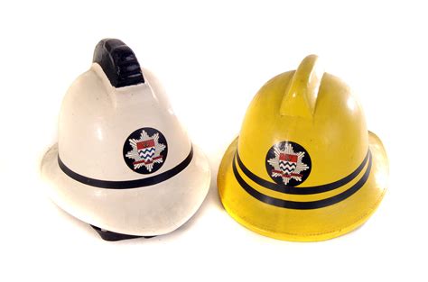 A Vintage London Fire Brigade Station Officers Fire Helmet Together