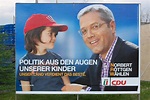 Röttgen mit Kind, Wahlplakat- www.leverkusen.com