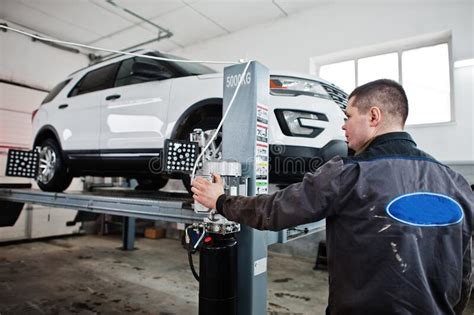 Auto Mechanic Sets American Suv Car For Diagnostics And Configuration