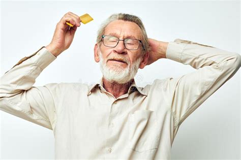 Elderly Man Combing Hair With Yellow Comb In Studio Stock Image Image