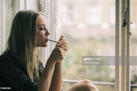 Young Woman Smoking Cigarette Photo Getty Images