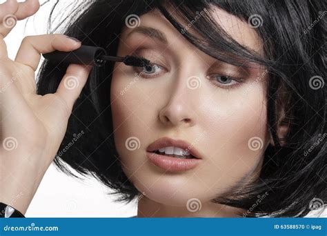 Young Beautiful Woman Applying Mascara Makeup On Eyes By Brush Stock