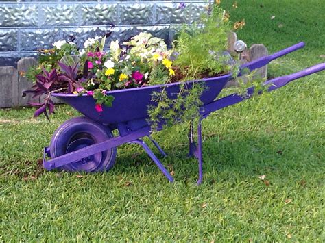 Old Wheelbarrow And Spray Paint And A Few Plants And I Have New Flower Bed