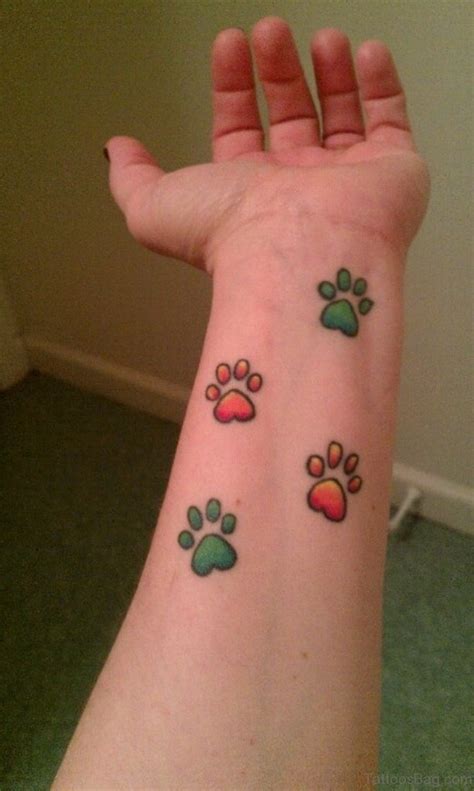 150+ puppy paw print tattoo designs for girls (2021) small colorful paw print tattoo ideas with meanings 35 Pretty Paw Print Tattoos For Wrist