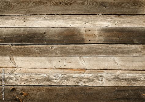 Dark Brown Reclaimed Wood Surface With Aged Boards Lined Up Wooden Planks On A Wall Or Floor