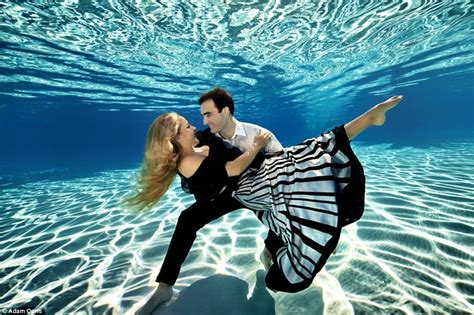 Photographer Adam Opris Captures Clothed Couples Kiss And Pose In Ethereal Underwater Engagement