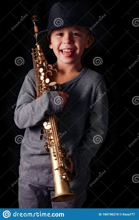 Happy Child Plays Saxophone In Studio Stock Image Image Of Person